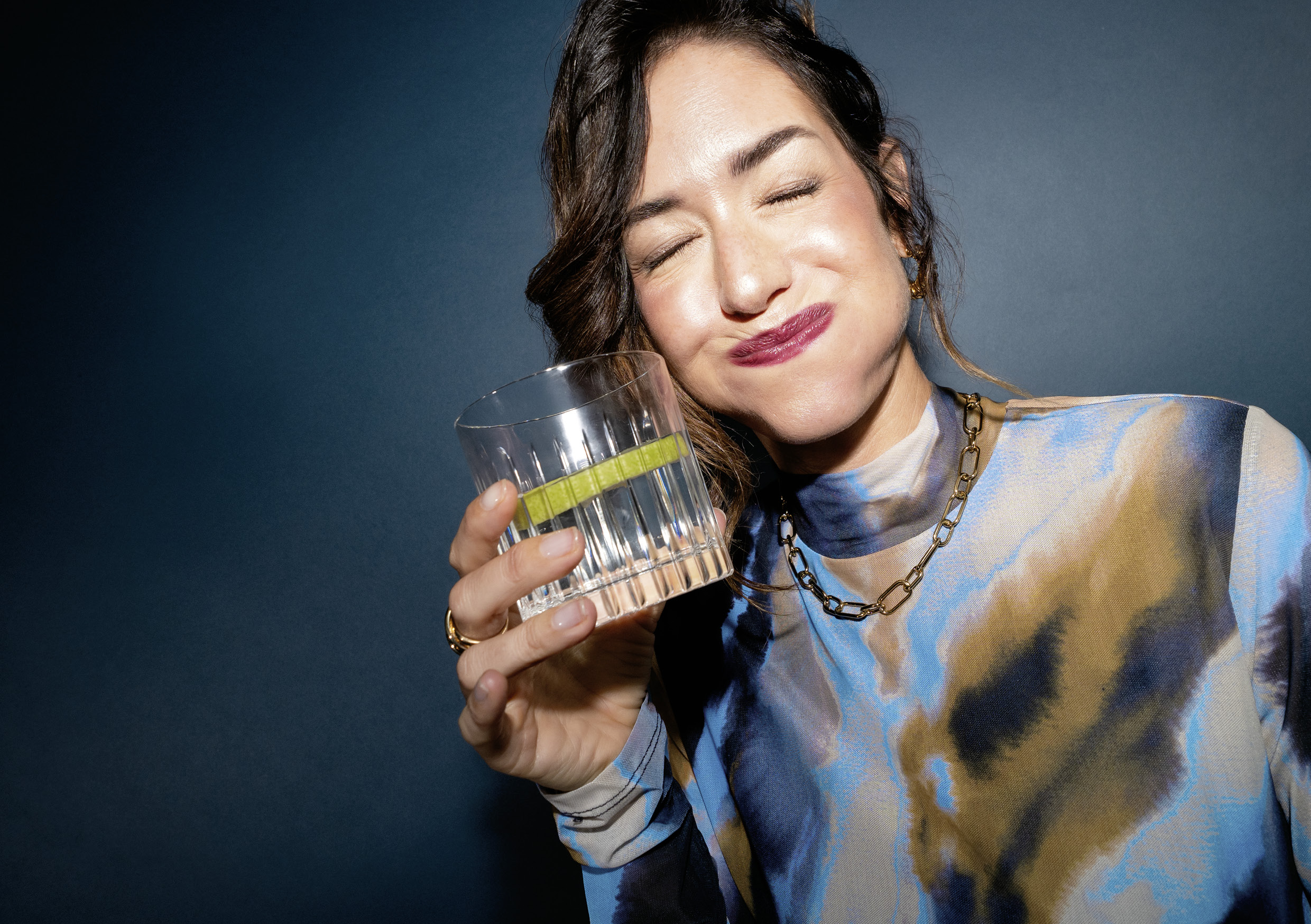 Woman drinking GROHE Blue water.